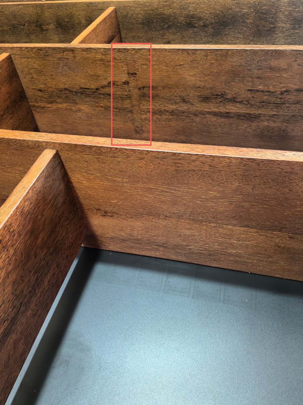 wood-a-rejected Palmwood surface held during quality control