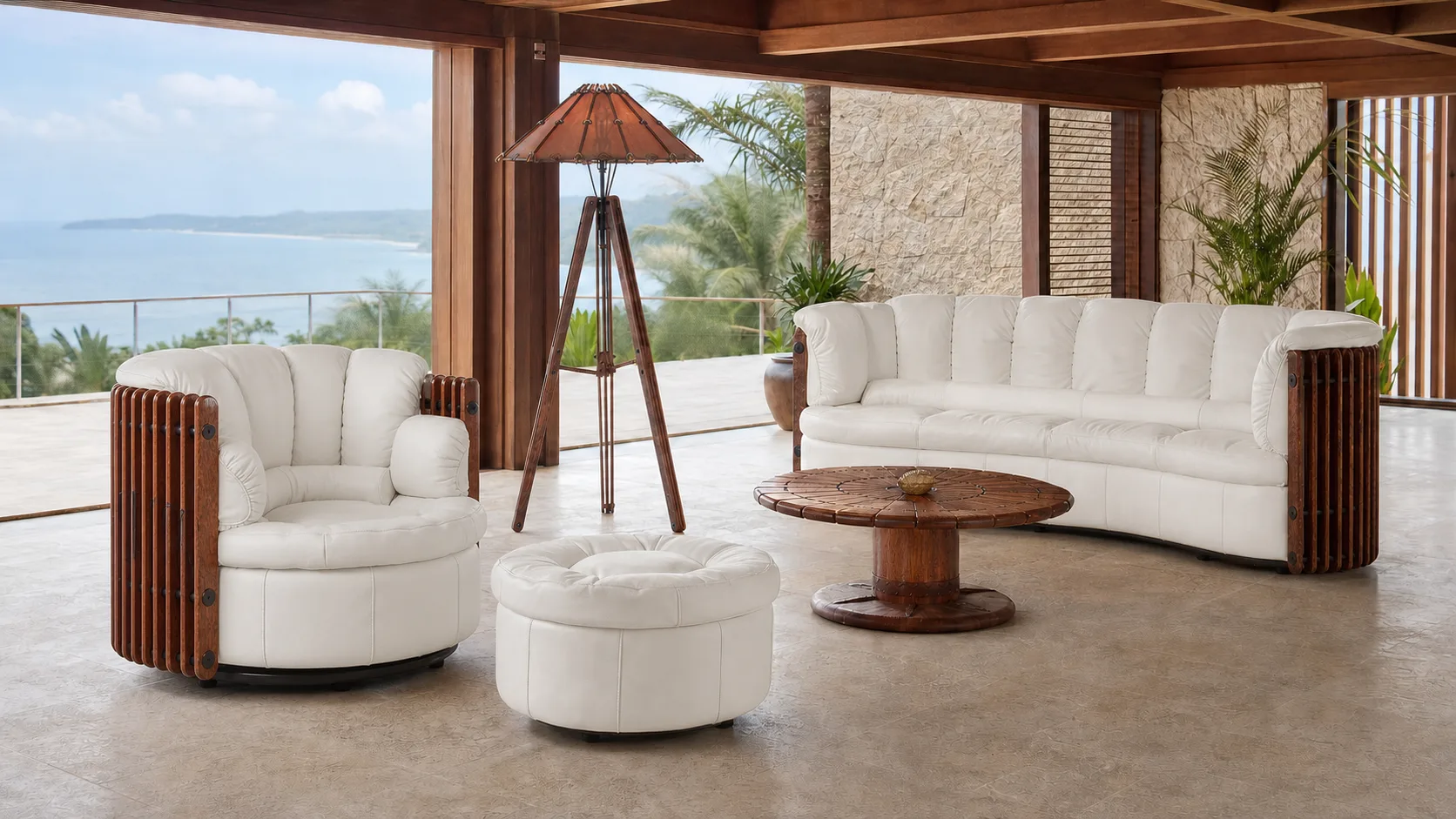 Pacific Green Isle D’Palm Armchair with matching sofa, ottoman, circular coffee table and Tavarua lamp in an ocean pavilion